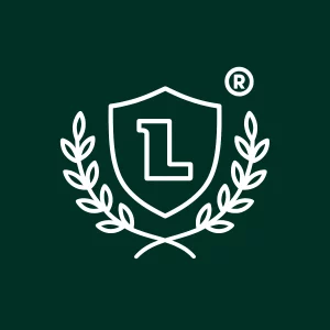 Icône d’un logo professionnel protégé par un bouclier et des branches de laurier